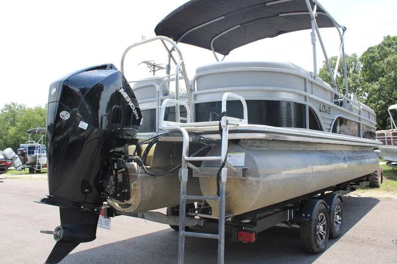 Slide: The Image of 2021 Lowe SS250 Super Sport pontoon boat on trailer with outboard motor. - 10