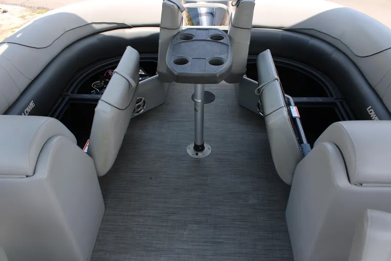 Slide: The Image of 2021 Lowe SS250 Super Sport boat interior with seating and cup holders. - 4