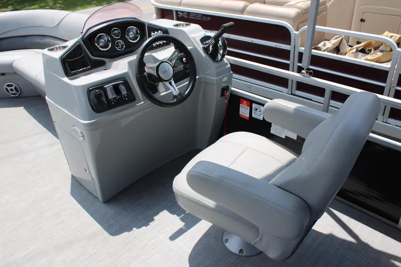 Slide: The Image of 2021 Lowe SS250 Super Sport boat helm with steering wheel and captain's chair. - 5