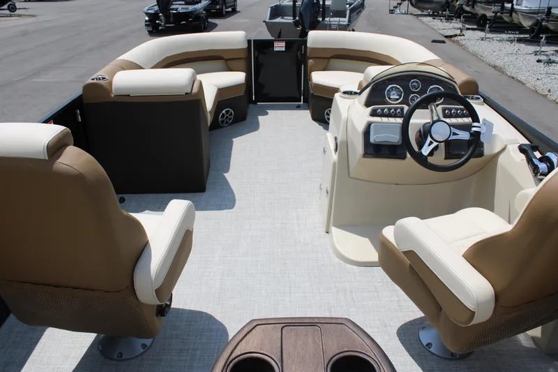 Slide: The Image of 2023 Lowe SS210 Super Sport pontoon boat interior with beige and brown seating. - 5
