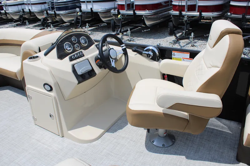 Slide: The Image of 2023 Lowe SS210 Super Sport boat interior with captain's chair and control console. - 7
