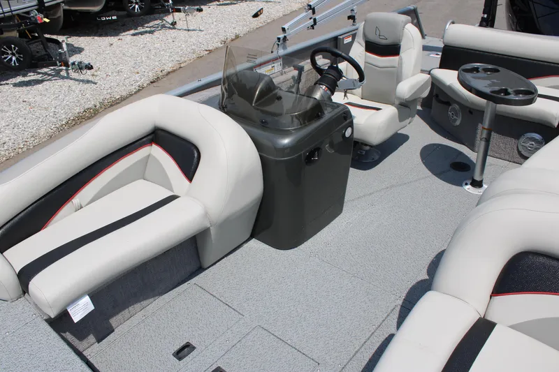 Slide: The Image of 2023 Lowe SD224 Sport Deck boat interior with seating and steering console. - 5