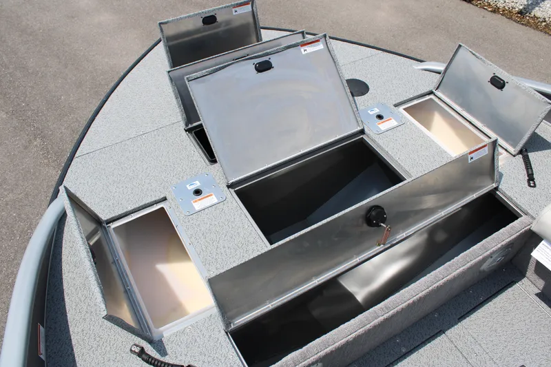 Slide: The Image of 2023 Lowe SD224 Sport Deck boat with open storage compartments. - 8