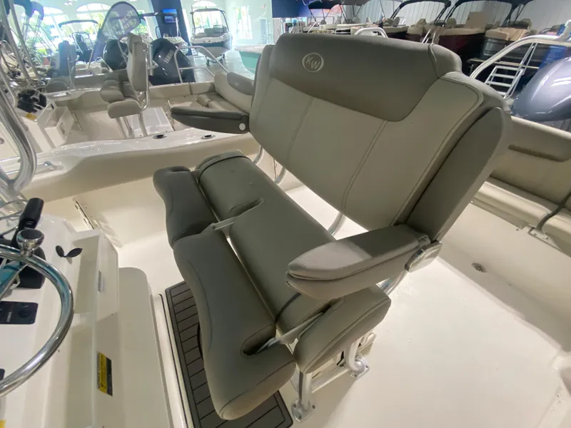 Slide: The Image of 2024 Key West 239 FS boat interior with cushioned seating. - 11