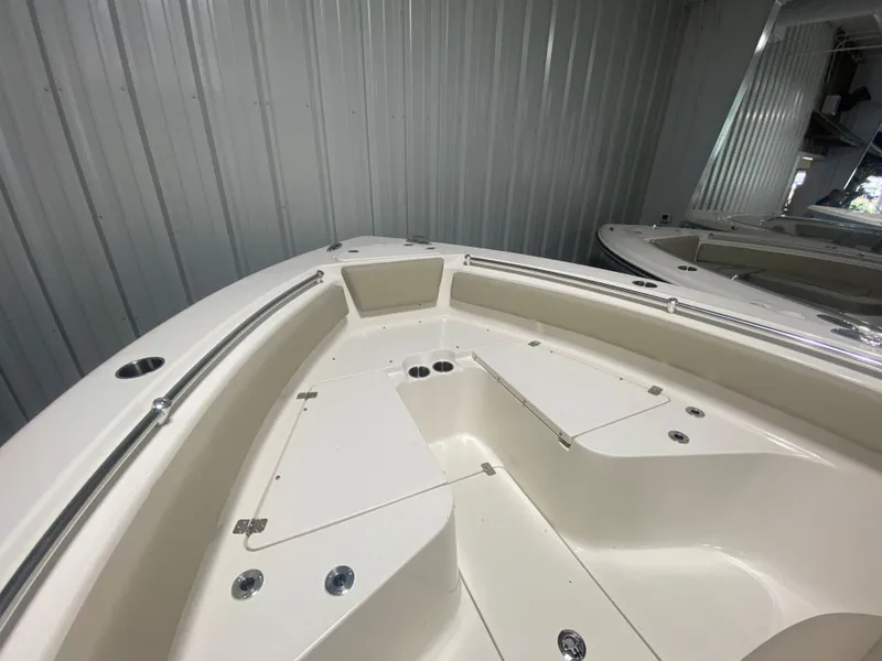 Slide: The Image of 2024 Key West 239 FS boat interior with storage compartments. - 22