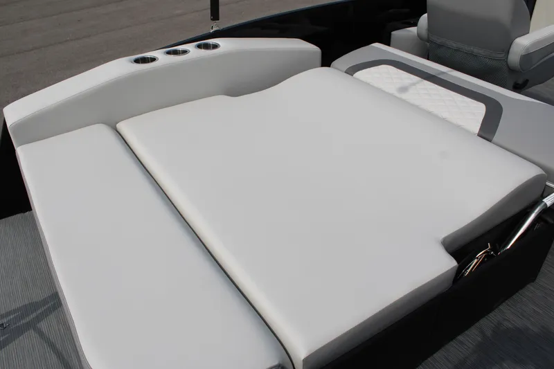 Slide: The Image of 2023 Lowe SS210 Super Sport boat with spacious cushioned seating area. - 14