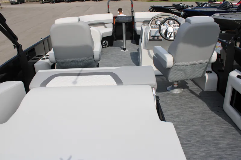 Slide: The Image of 2023 Lowe SS210 Super Sport boat interior with seating and steering console. - 15