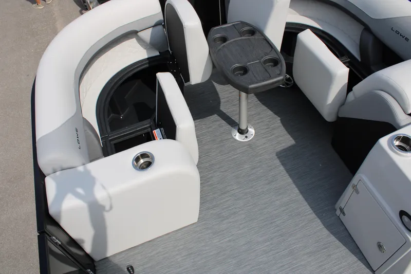 Slide: The Image of 2023 Lowe SS210 Super Sport boat interior with seating and table. - 7