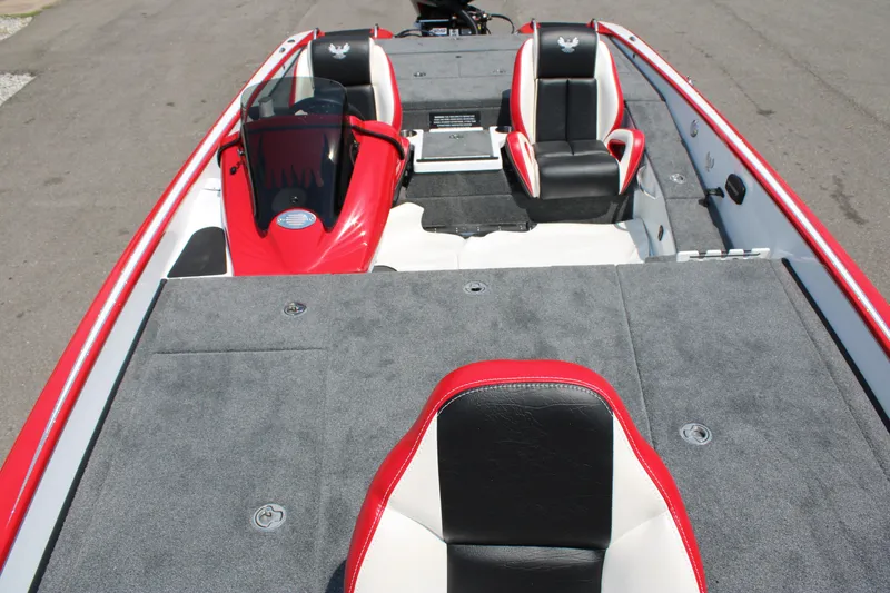 Slide: The Image of 2024 Phoenix 21 PHX boat interior with red and black seats, gray carpet. - 11