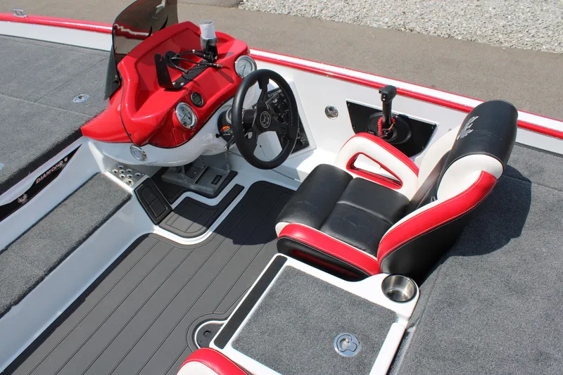Slide: The Image of 2024 Phoenix 21 PHX boat interior with red and black seats and modern dashboard. - 14