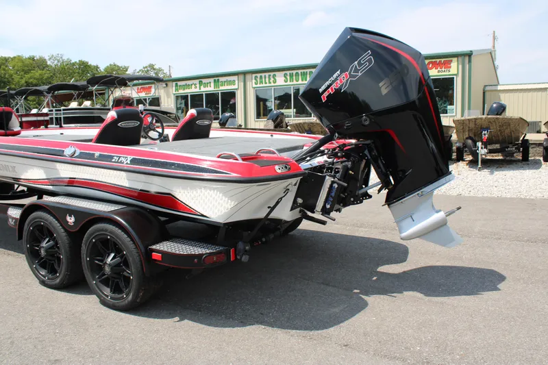 Slide: The Image of 2024 Phoenix 21 PHX boat with powerful outboard motor on trailer. - 3