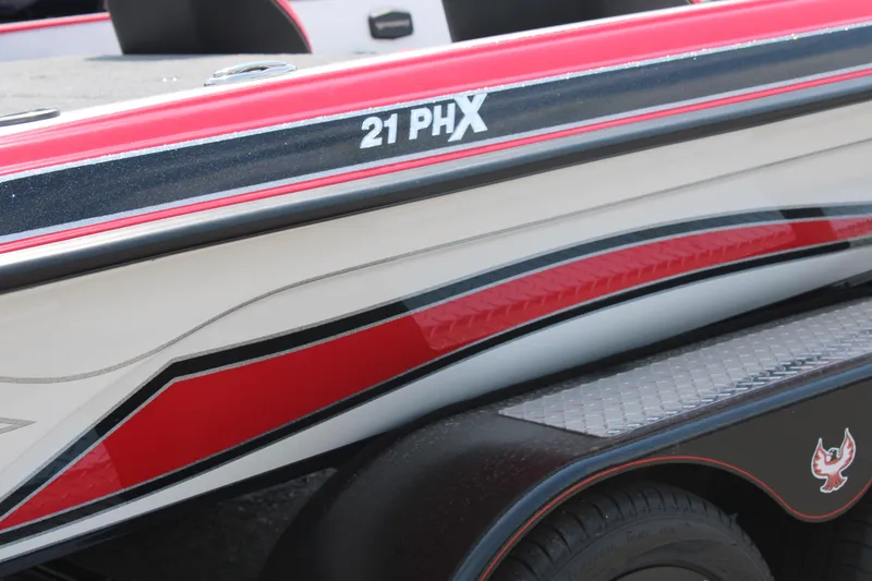 Slide: The Image of 2024 Phoenix 21 PHX boat with red and black detailing. - 6