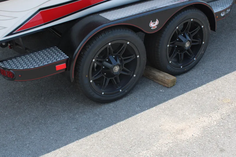 Slide: The Image of 2024 Phoenix 21 PHX boat trailer with black alloy wheels. - 7