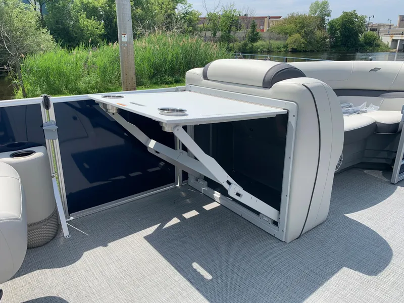 Slide: The Image of 2023 Starcraft EX 24 R pontoon boat with foldable table and seating. - 10
