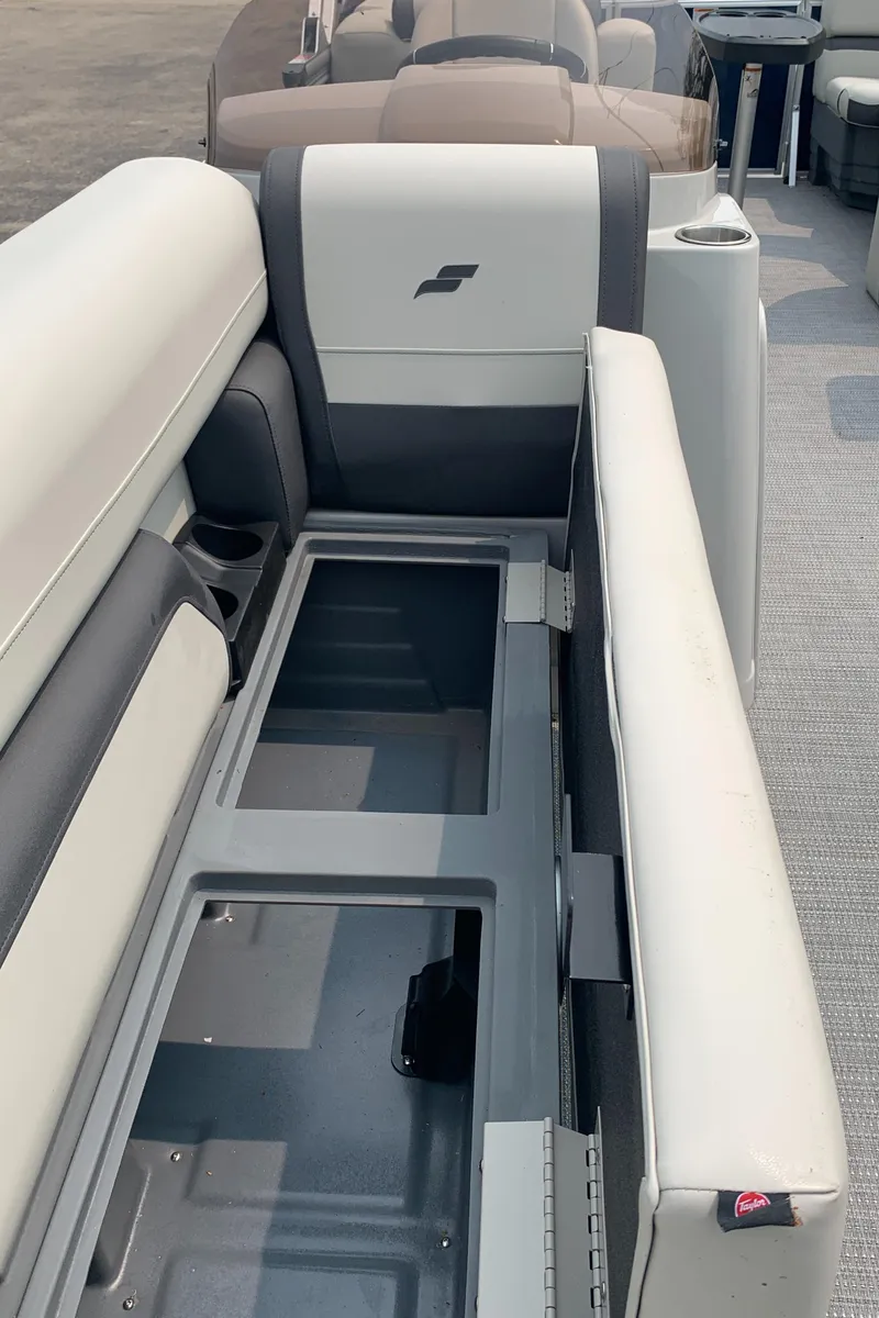 Slide: The Image of 2023 Starcraft EX 24 R boat interior seating and storage compartment. - 15