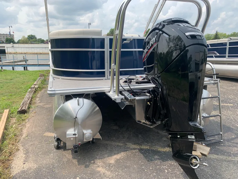 Slide: The Image of 2023 Starcraft EX 24 R pontoon boat with Mercury outboard motor. - 19