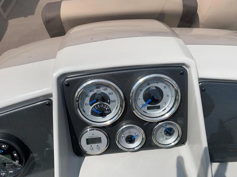 Slide: The Image of Dashboard of 2023 Starcraft EX 24 R boat with gauges and controls. - 3