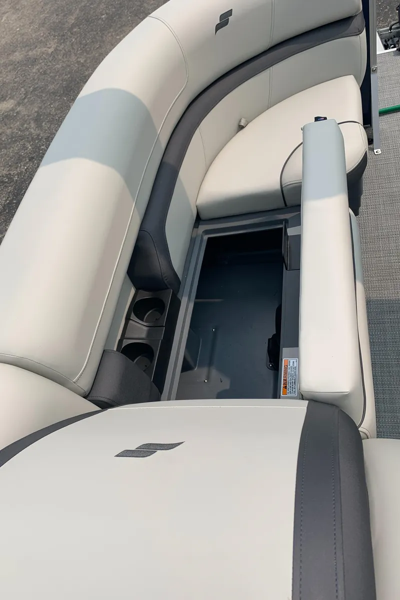 Slide: The Image of 2023 Starcraft EX 24 R pontoon boat with open storage compartment. - 5