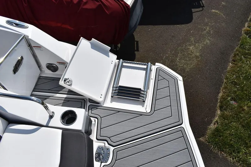 Slide: The Image of 2024 Monterey M6 boat with foldable ladder and cushioned seating. - 18