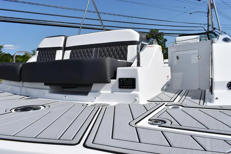 Slide: The Image of 2024 Monterey M6 boat with sleek seating and modern deck design. - 23