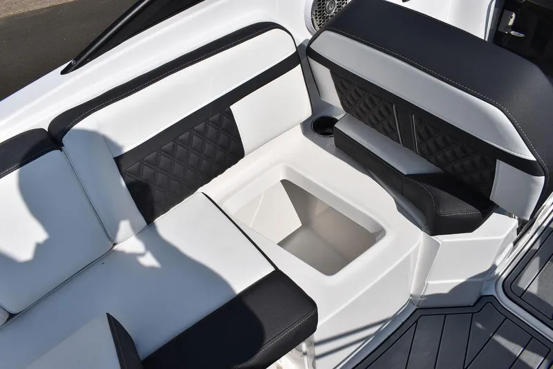 Slide: The Image of 2024 Monterey M6 boat seating area with storage compartment. - 27