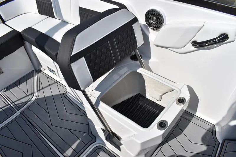 Slide: The Image of 2024 Monterey M6 boat interior with storage compartment and seating. - 30