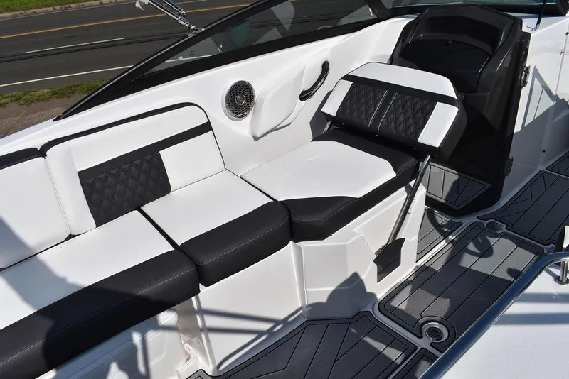 Slide: The Image of 2024 Monterey M6 boat interior with black and white seating and modern design. - 32