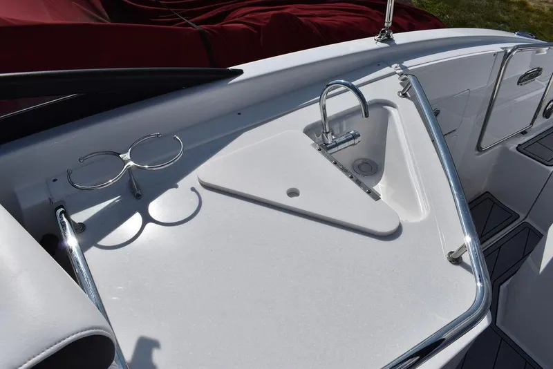 Slide: The Image of 2024 Monterey M6 boat sink and cup holders on deck. - 34