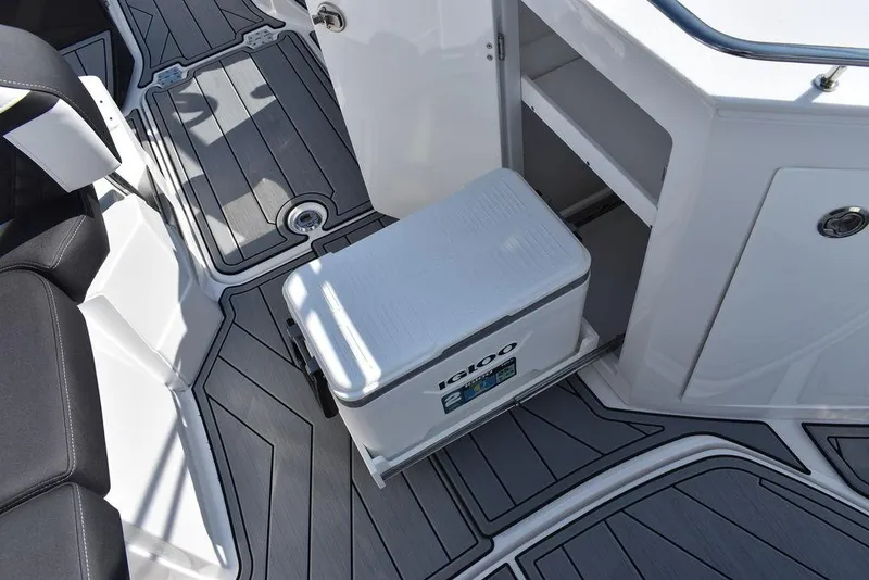 Slide: The Image of 2024 Monterey M6 boat interior with cooler and storage compartment. - 37