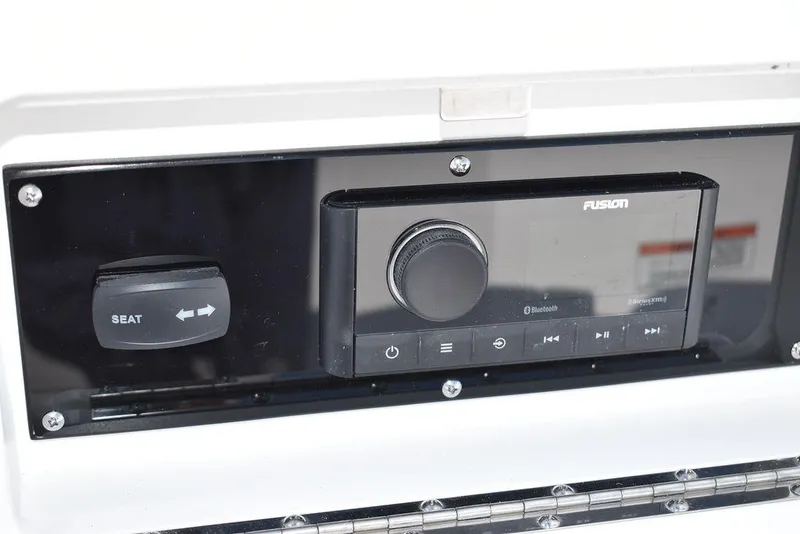 Slide: The Image of 2024 Monterey M6 boat dashboard with Fusion audio system and seat control. - 39