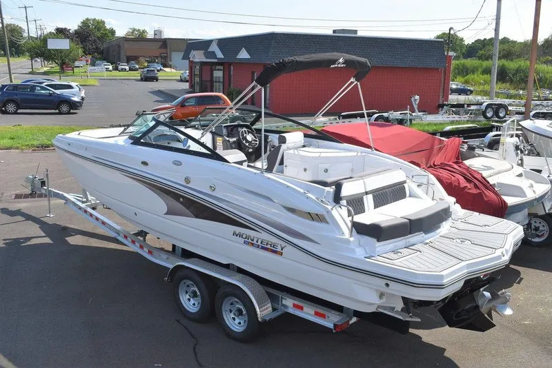 Slide: The Image of 2024 Monterey M6 boat on trailer in parking lot. - 4