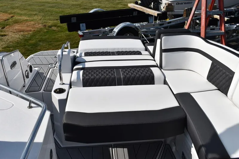 Slide: The Image of 2024 Monterey M6 boat with luxurious black and white seating on deck. - 41
