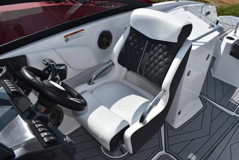 Slide: The Image of 2024 Monterey M6 boat captain's seat with black and white upholstery and modern dashboard. - 45