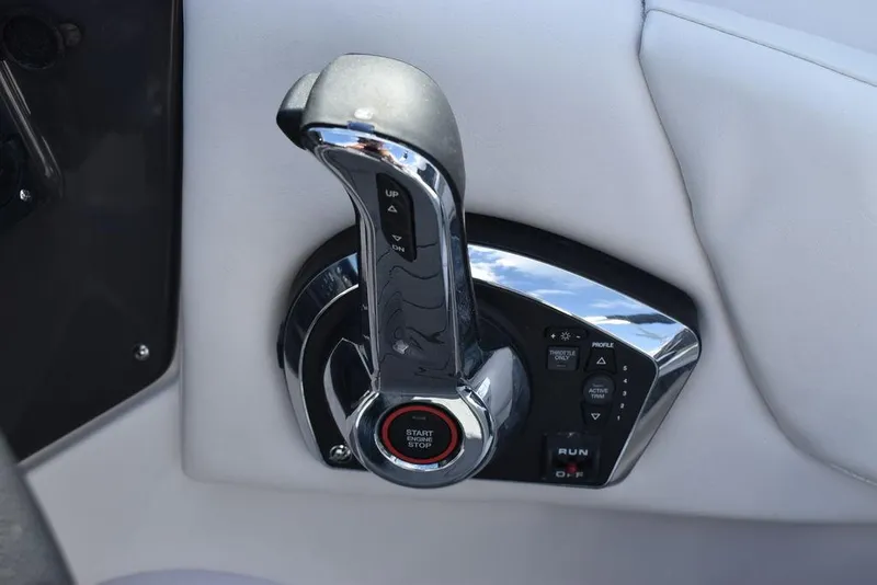 Slide: The Image of 2024 Monterey M6 boat throttle control and start/stop button. - 48