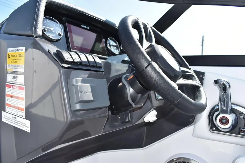 Slide: The Image of 2024 Monterey M6 boat dashboard with steering wheel and control panel. - 49