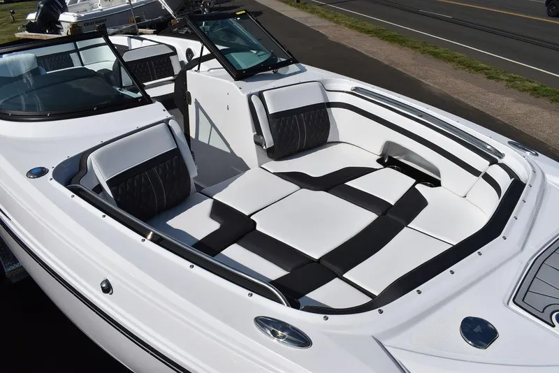 Slide: The Image of 2024 Monterey M6 boat with spacious white and black seating area. - 9