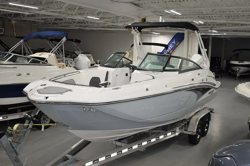 The Image of 2024 Monterey M-65 boat on trailer in indoor showroom. - 0