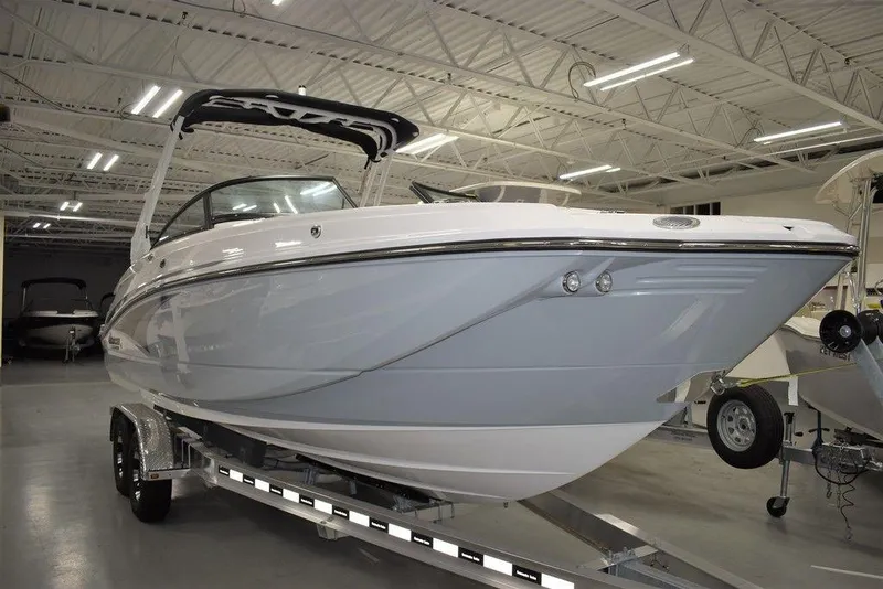 Slide: The Image of 2024 Monterey M-65 boat on trailer in indoor showroom. - 3