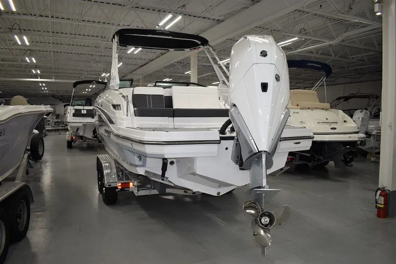 Slide: The Image of 2024 Monterey M-65 boat in showroom, rear view with outboard motor. - 5