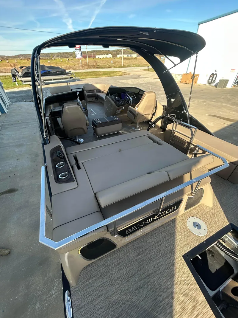 Slide: The Image of 2023 Bennington 28 QXSBW luxury pontoon boat with spacious seating and sleek design. - 10