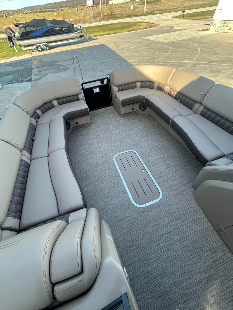 Slide: The Image of 2023 Bennington 28 QXSBW boat interior with spacious seating and modern design. - 3