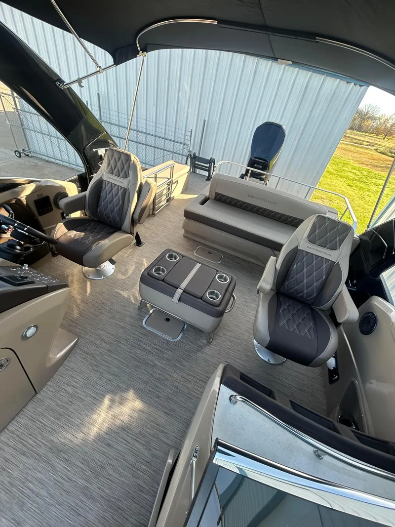 Slide: The Image of 2023 Bennington 28 QXSBW boat interior with luxurious seating and modern design. - 4