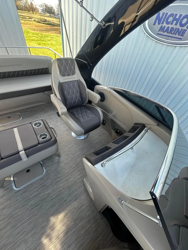 Slide: The Image of 2023 Bennington 28 QXSBW boat interior with luxurious seating and modern design. - 5