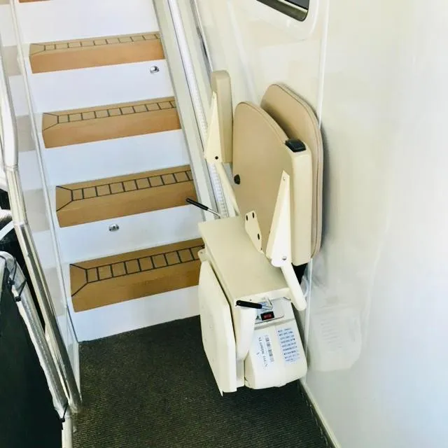 Slide: The Image of Staircase with a 2016 Thoroughbred 67x17 model stairlift installed. - 21