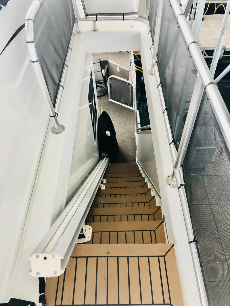 Slide: The Image of Staircase on a 2016 Thoroughbred 67x17 houseboat. - 23