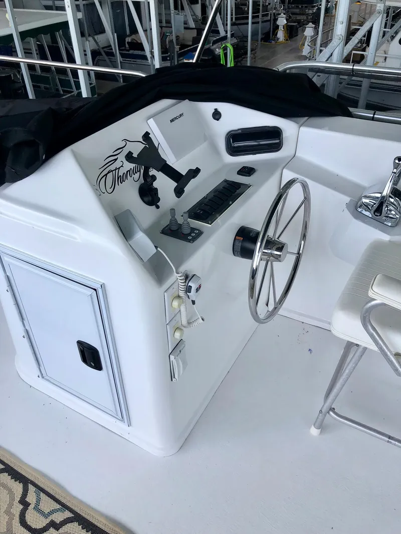 Slide: The Image of Control panel of a 2016 Thoroughbred 67x17 boat. - 27