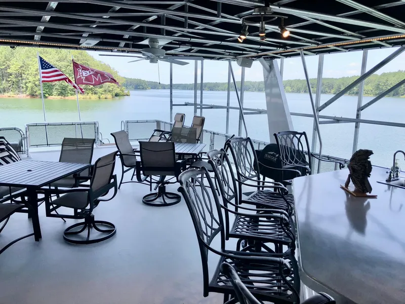 Slide: The Image of Upper deck of 2016 Thoroughbred 67x17 houseboat with lake view and seating area. - 30