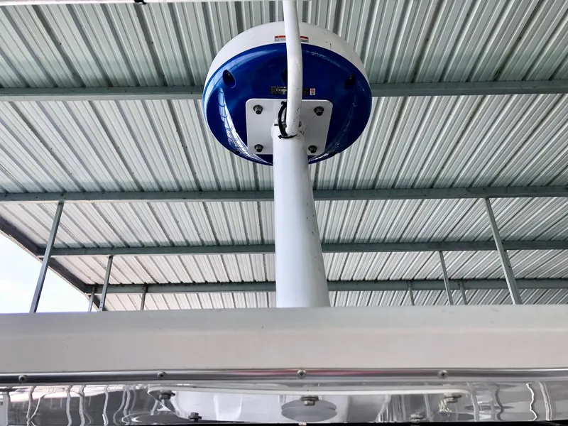 Slide: The Image of Radar dome on a 2016 Thoroughbred 67x17 boat under a metal roof. - 35
