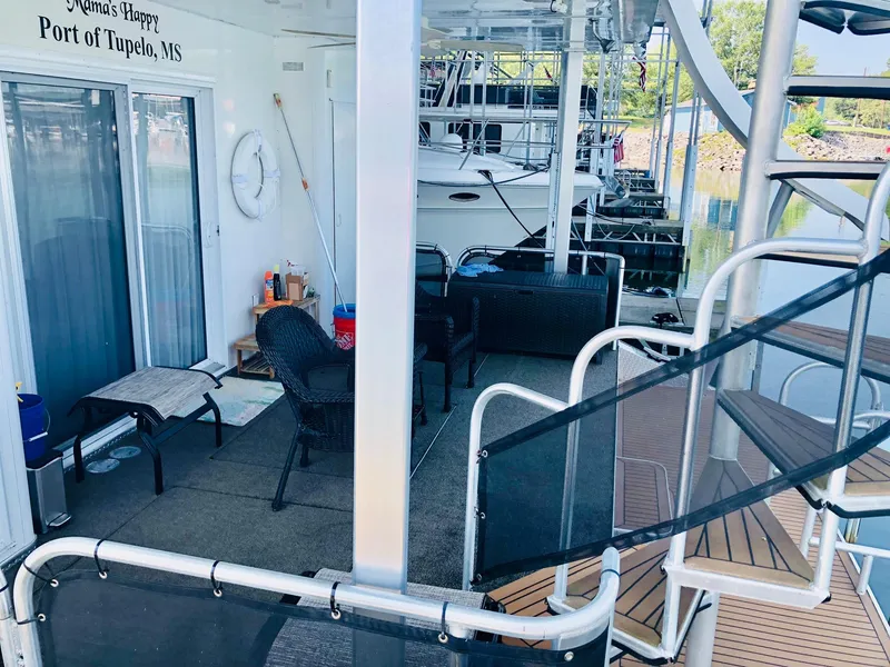 Slide: The Image of Houseboat Thoroughbred 67x17, 2016 model, docked at Port of Tupelo, MS, with outdoor seating area. - 40