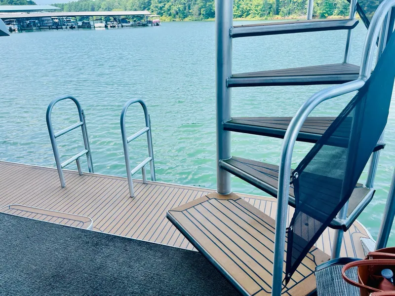 Slide: The Image of Houseboat deck with spiral staircase and lake view, Thoroughbred 67x17, 2016 model. - 42